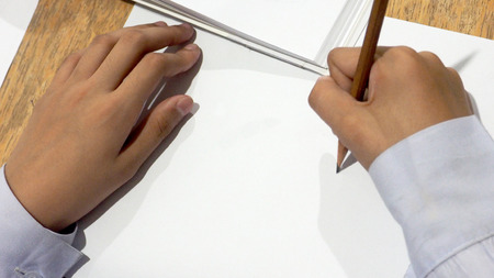 Background student girl with pencil to sketching on whitepaper havs copy space.