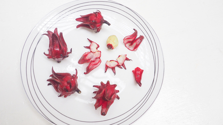 Fresh roselle raw fruit and herb for, Photo top view soft lighting and isolate on white has copy space.