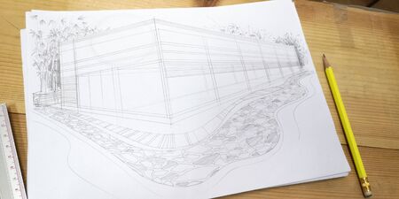 Architecture working concept is perspective sketch design in paper on the desk wood has accessories are pencil and ruler.の写真素材