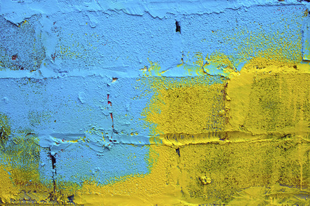 Blue and yellow paint on the wall. Symbolizes the flag of Ukraine.の写真素材