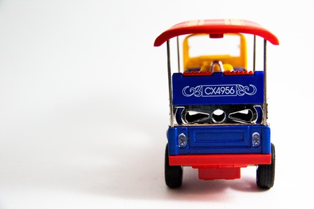 Back Tuktuk taxi model Thailand red blue yellow colors on white background - Thai souvenirs