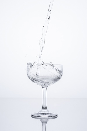 pouring water into glassの写真素材
