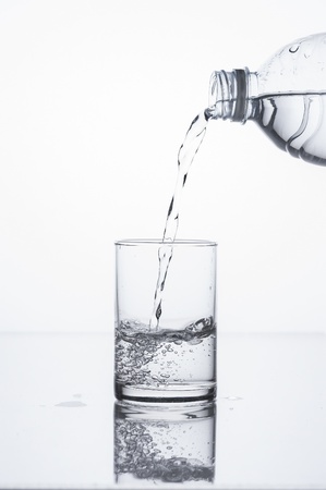 pouring liquid in to glassの写真素材