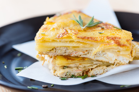 Crab pie with cheese and potato.