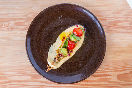 Smoked salmon with eggs, vegetables, amd sauce.の写真素材