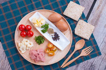 Ingredients for scramble egg on wood table.の写真素材