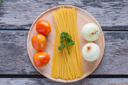 Ingredients for spaghetti on wood table.の写真素材