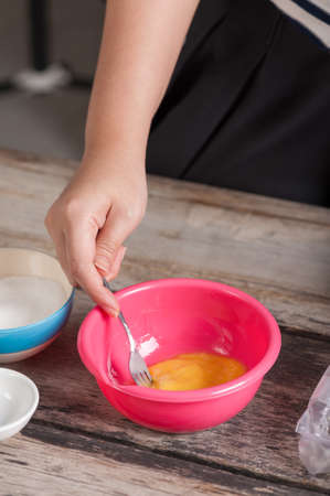 Whipping egg for making cookieの写真素材