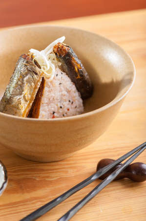 Japanese rice with japanese plum onigiri with fried Sanma