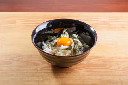 Japanese rice with seaweed and preserved egg yolkの写真素材