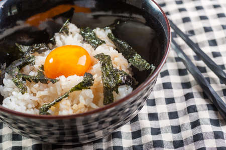 Japanese rice with seaweed and preserved egg yolkの写真素材