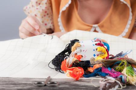 Cross-stitch, a housewife hobby in spare time.