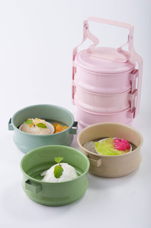 Thai dessert with sweet sticky rice and ice cream in food carrierの写真素材
