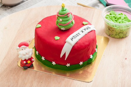 Christmas concept fodant cake in kitchen.の写真素材