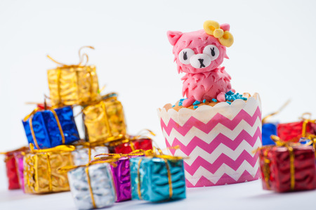 Fondant cup cake on white tableの写真素材