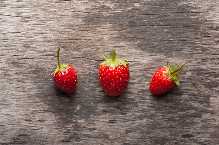 Fresh strawberries from farm on wood table.の写真素材