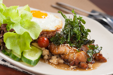 Brown rice with stir-fried mushroom and basil with Teriyaki chickenの写真素材
