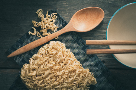 Instant noodles on wood table with film filter effectの写真素材