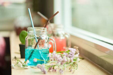 Italian soda on wood bar in cafeの写真素材