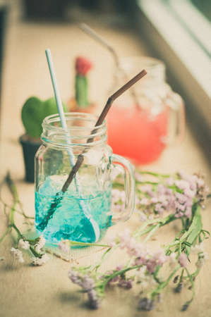 Italian soda on wood bar in cafe with film filter effectの写真素材