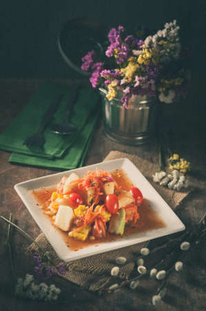 Thai mix fruit spicy dressed salad with film filter effectの写真素材