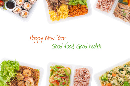 sushi, stir fried fish, fettuccine, roasted pork, grilled pork with eggs, and Shrimp and vermicelli baked with herbs cooked by clean food concept on white background with "Happy new year Good food good health" message.の写真素材