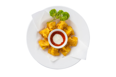 Top view of Chinese style deep-fried wonton with sweet and sour sauce in ceramic dish isolated on white background with clipping pathの写真素材