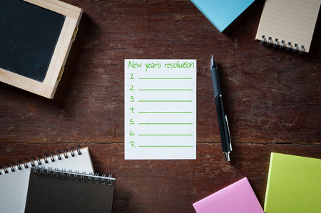 New year's resolution is written on Blank paper with area for text or message, pen, notebook, and...