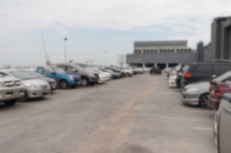 Blurred background of car parking area on roof top. Abstract scene of vehicle in cityの写真素材