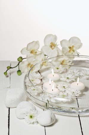 Aromatherapy bowl with white orchidsの写真素材