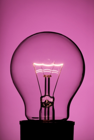 Light bulb with red backgroundの写真素材