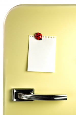 Blank note on fifties fridge door, copyspace for messageの写真素材