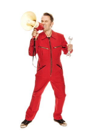 Mechanic in red Overall screaming into a megaphone, isolated on whiteの写真素材