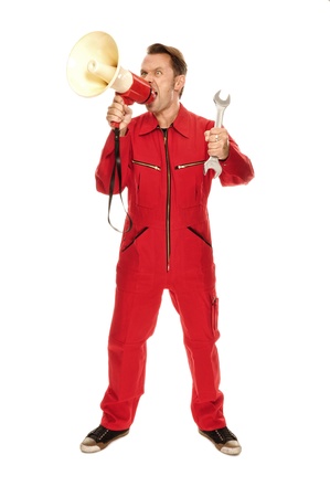 Mechanic in red Overall - screaming madly; isolated on whiteの写真素材