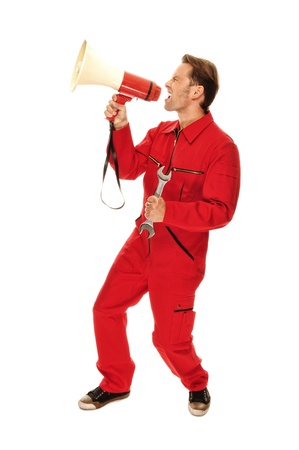 Mechanic in red Overall - screaming into a megaphoneの写真素材