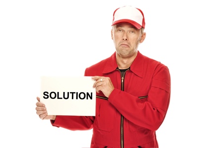 Mechanic in red Overall wth whining face expression and "Solution" sign. Who needs a solution? IÂ´d like to keep my problem.の写真素材