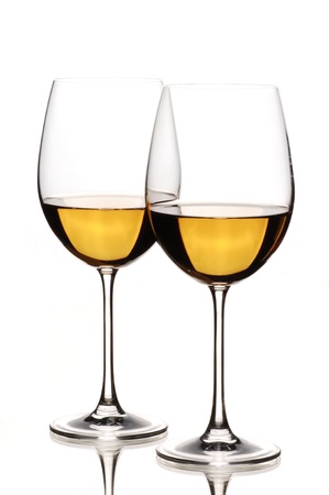 Two glasses of white wine, isolated on whiteの写真素材