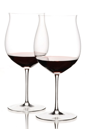 Two glasses of red wine on white backgroundの写真素材