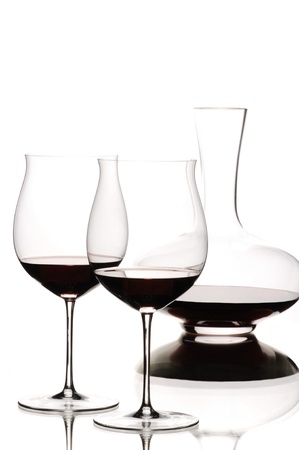 Red wine and decanter on white backgroundの写真素材