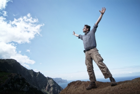 Man reaching out for the skyの写真素材