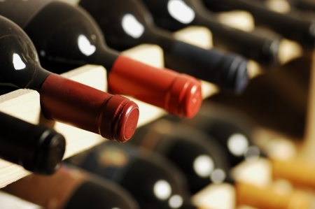 Wine bottles stored in a shelf, very shallof DoFの写真素材