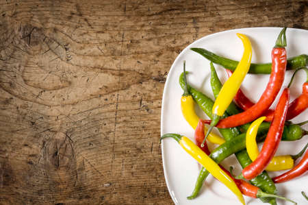 Three coloured Chilies on a plate