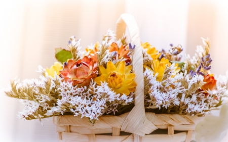 beautiful bouquet of bright wildflowers in basketの写真素材