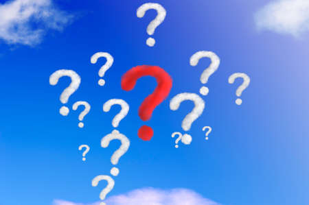 Unique red question mark shape of cloud among many clouds on blue sky. Standing out from crowd and different. Concept idea or problem.の写真素材