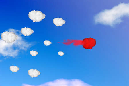 Group of clouds with one red cloud goes faster than others. Concept best employの写真素材
