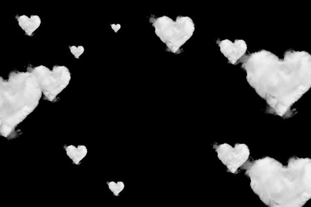 Clouds shape hearts on black background. Perfect for compositionの写真素材