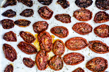 Sun dried tomatoes on a metal trayの写真素材