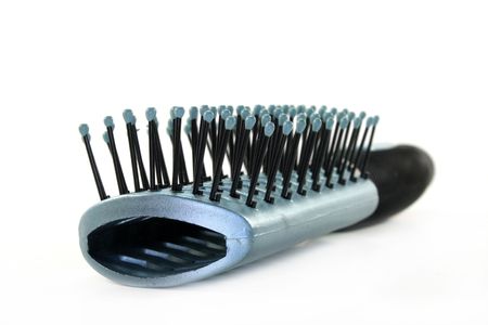 Close-up of a hair brush on a white backgroundの写真素材