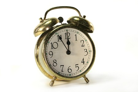 old alarm clock with bells on white backgroundの写真素材