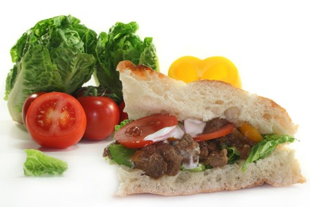 Pita bread filled with onion meat and vegetablesの写真素材